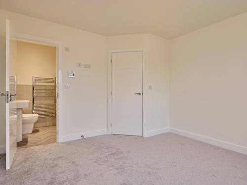 Image showing a bedroom and en suite at 28 Charnwood Street, Swinton.