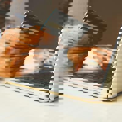 Image of someone holding a bank card.