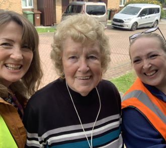 Image of employees with a tenant.
